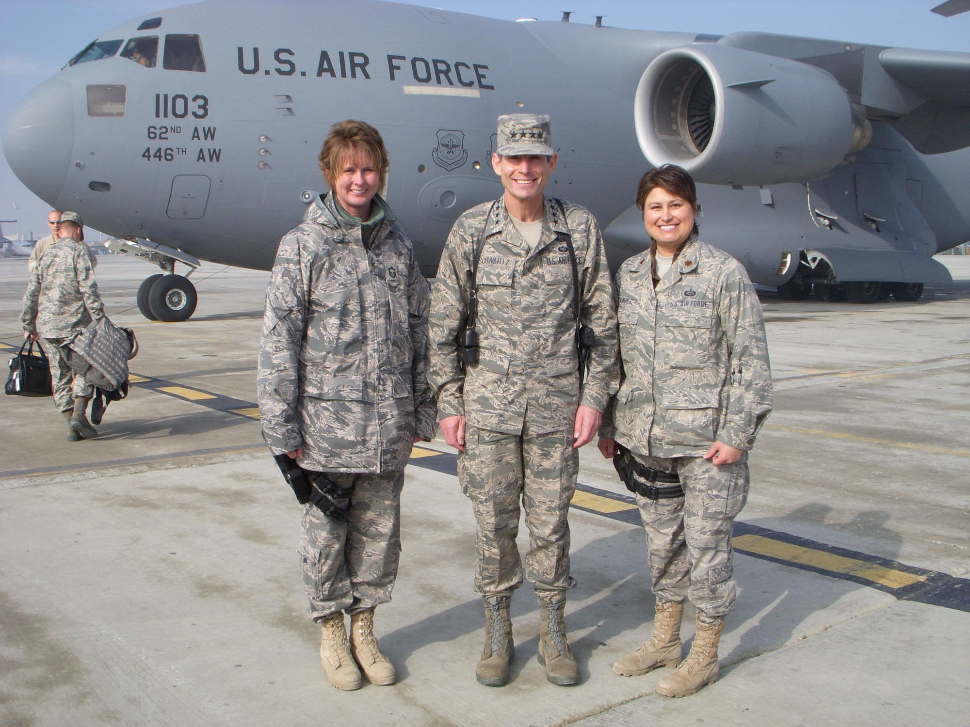 Chief Master Sgt. Milissa Fowler, (left) 153rd Airlift Wing, Force Support Squadron superintendent, and Maj. Nicole Chavez (right), meet Gen. Norton Schwartz, (center) then Chief of Staff of the Air Force, during their support of Operation Enduring Freedom in 2009 where they assisted with protocol. (Courtesy photo)
