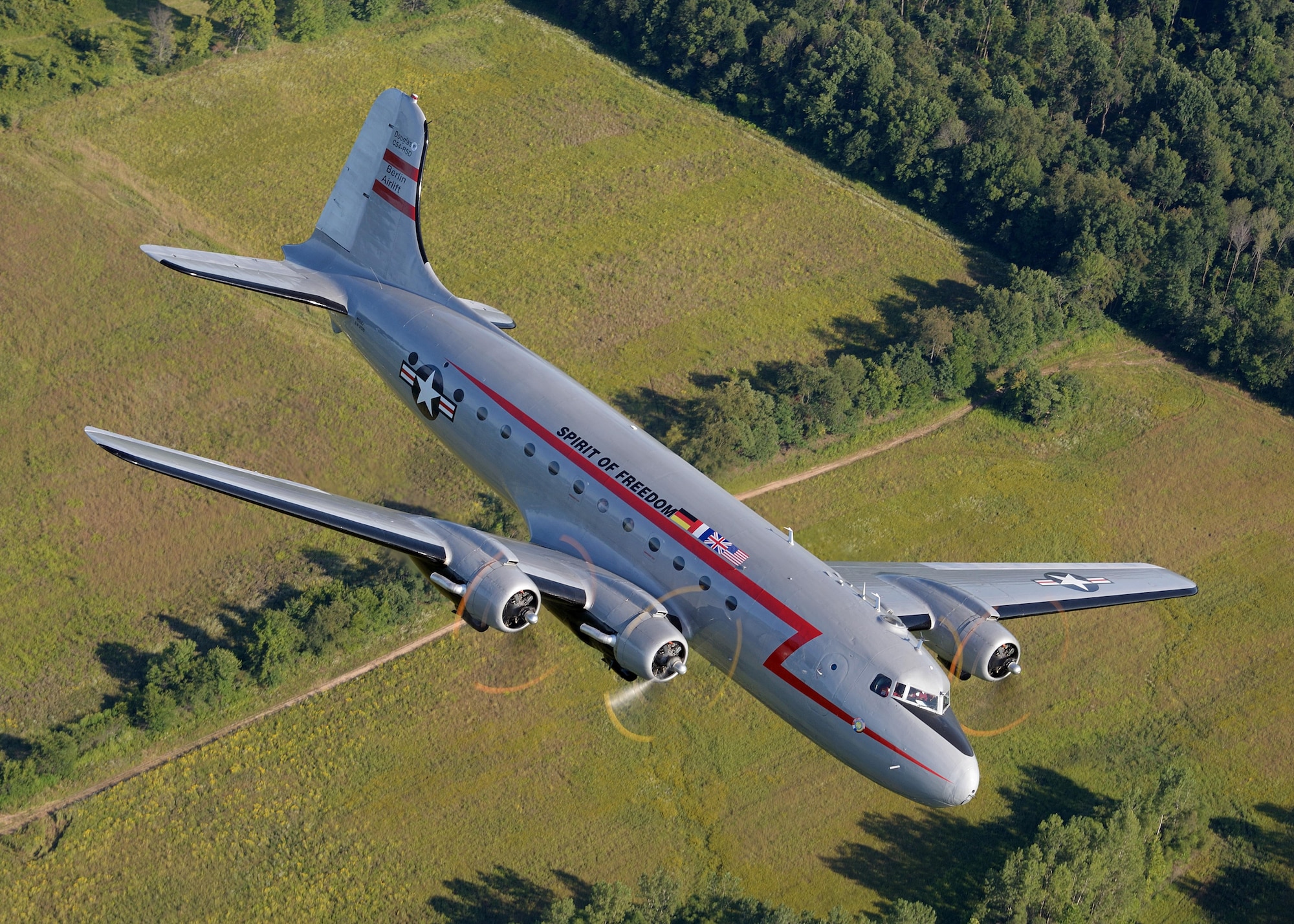 C-54 'Spirit of Freedom' in-flight during a training mission near Warsaw, Indiana in August 2014. The aircraft is owned and operated by the Berlin Airlift Historical Foundation which keeps the aircraft flying and available to the public through important educational outreach and air show appearances. Photo courtesy Greg Morehead.