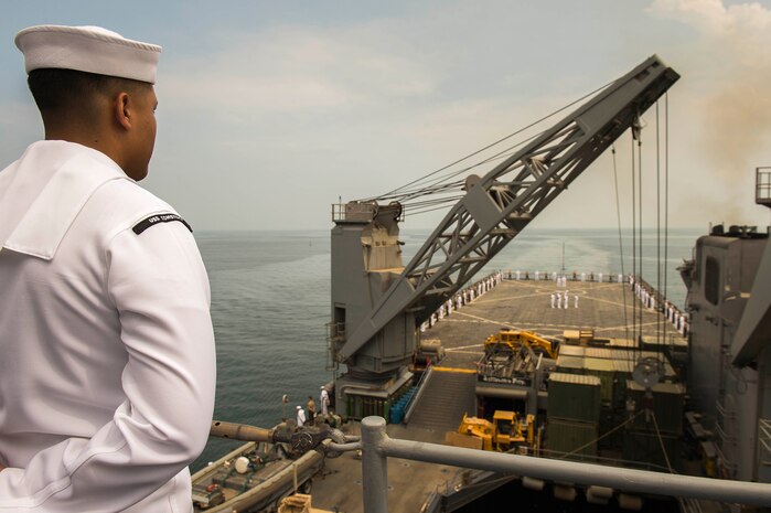 Sailors and Marines aboard the amphibious dock landing ship USS Comstock (LSD 45) man the rails as the ship arrives in Colombo, Sri Lanka, to conduct theater security cooperation events with the Sri Lankan Navy and Marine Corps, Mar. 27, 2017. Comstock, part of the Makin Island Amphibious Ready Group, with the embarked 11th Marine Expeditionary Unit, is on a scheduled deployment to the U.S. 7th Fleet area of operations. 