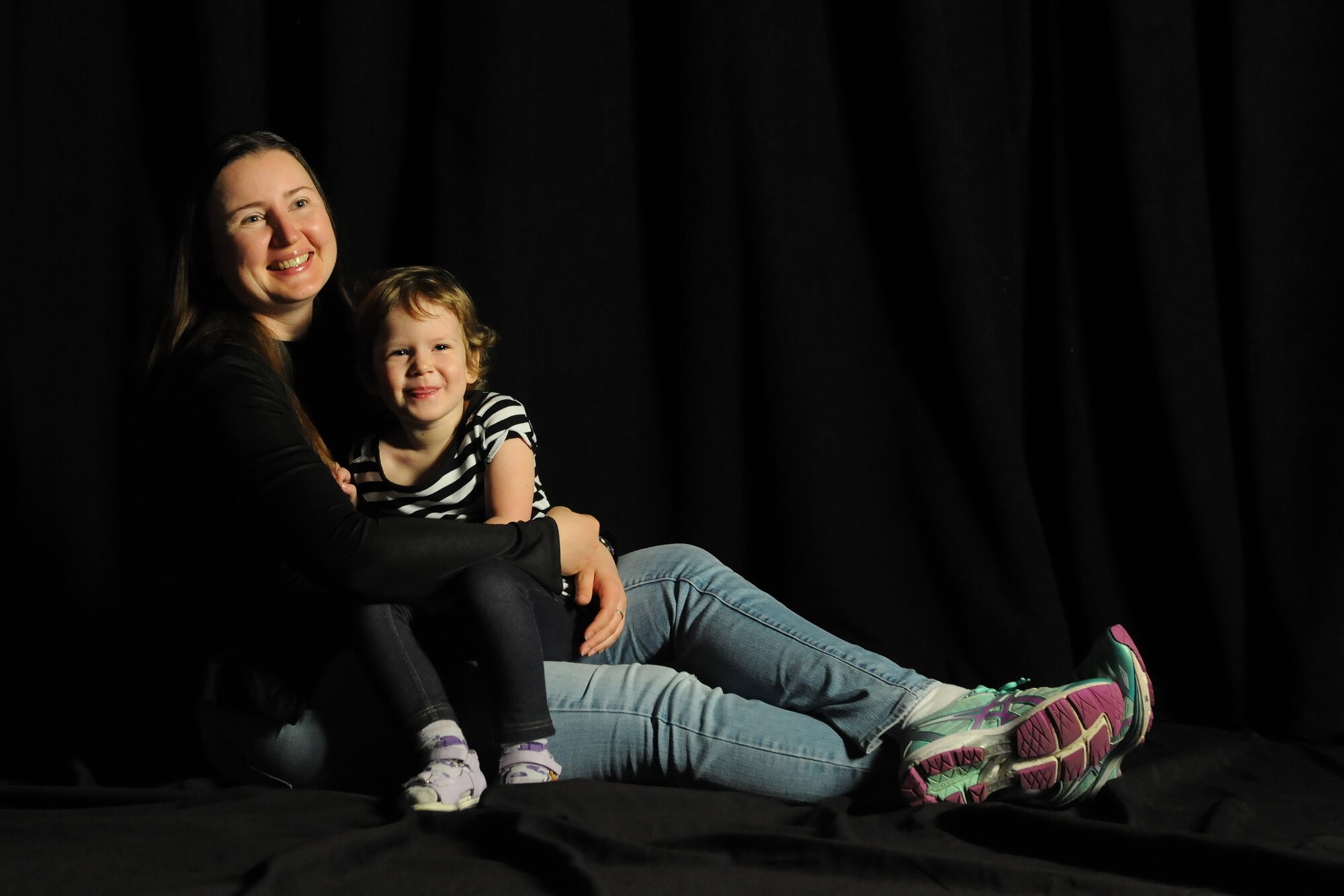 Airman 1st Class Vera Povetina, 335th Training Squadron student, and her daughter pose for a photo March 10, 2017, on Keesler Air Force Base, Miss. Povetina grew up in Kazkhstan and moved to America to fulfil her childhood dream of being in the U.S. military. (U.S. Air Force photo by Senior Airman Holly Mansfield) 