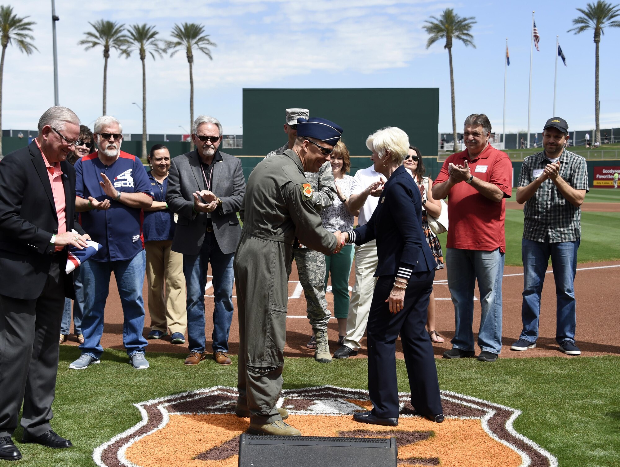 Brig. Gen. Brook Leonard, 56th Fighter Wing commander, shakes hands with Georgia Lord, city of Goodyear mayor, during the Great American Defense Community award presentation March 25, 2017, at the Goodyear Ballpark in Goodyear, Ariz. The Great American Defense Community Award symbolizes the support Luke receives from the West Valley Partners. (U.S. Air Force photo by Airman 1st Class Alexander Cook)