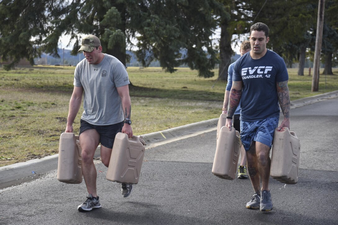 Individual competitors completed a 200 meter farmer's walk with weighted containers. (U.S. Air Force photo/2nd Lt. Katherine Miranda)
