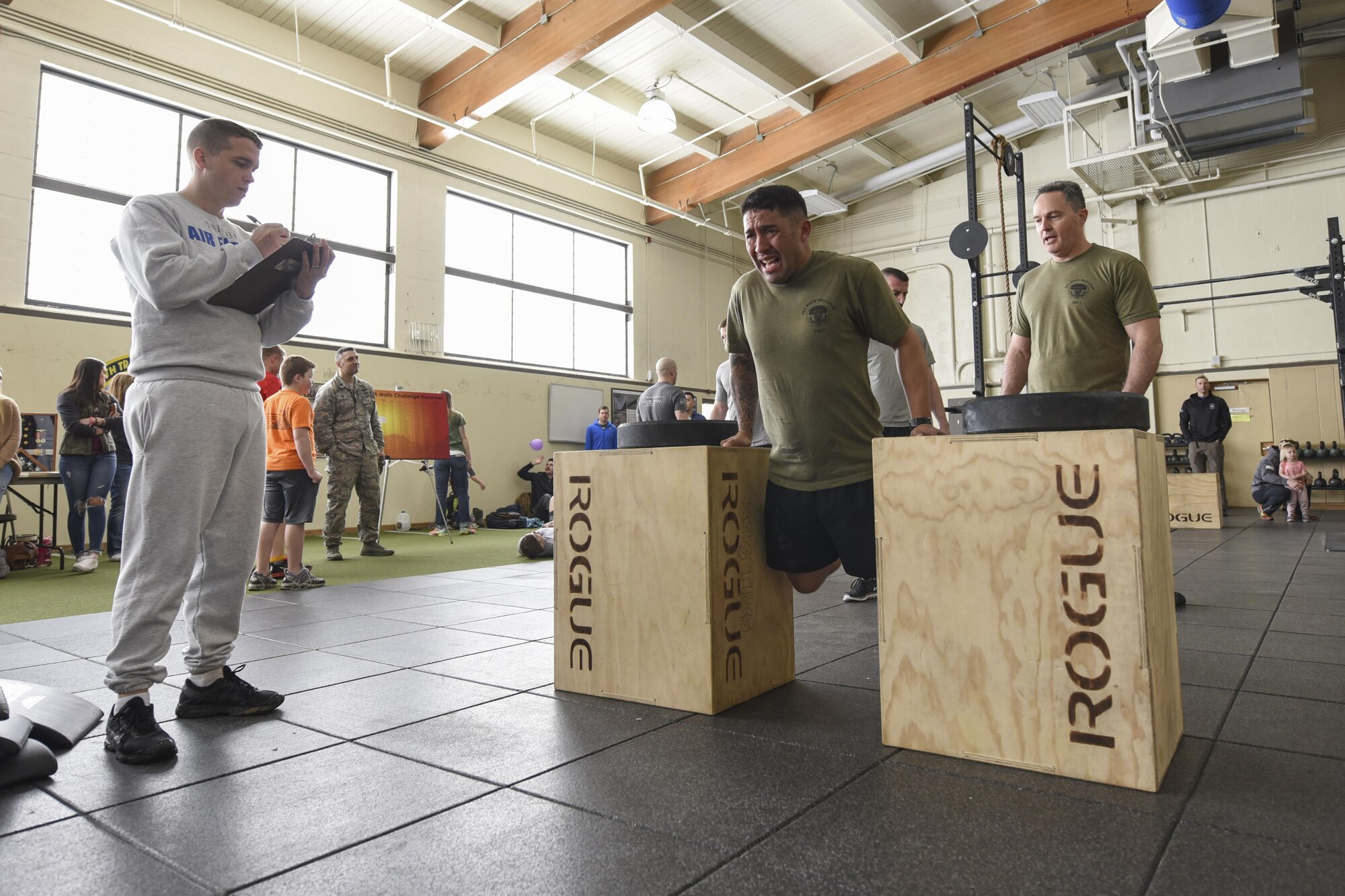 A competitor fights to complete 50 dips before moving on to the push up portion of the challenge. (U.S. Air Force photo/2nd Lt. Katherine Miranda)