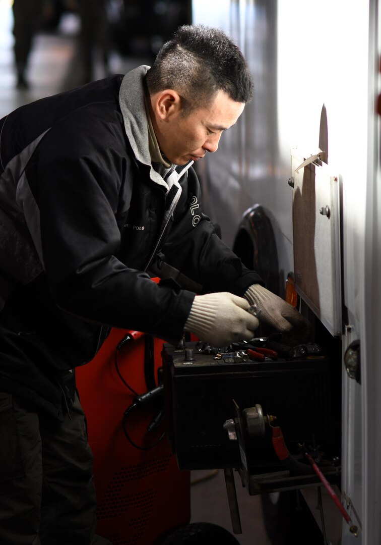 Pang Tae-kon, 51st Logistics Readiness Squadron technician, works on a vehicle battery in the Vehicle Maintenance Shop at Osan Air Base, Republic of Korea, March 22, 2017. Approximately 35 civilians and 70 Airmen work together in the Vehicle Maintenance Shop to ensure Team Osan’s vehicle fleet receives quality repairs as quickly as possible. (U.S. Air Force photo by Staff Sgt. Alex Fox Echols III/Released)