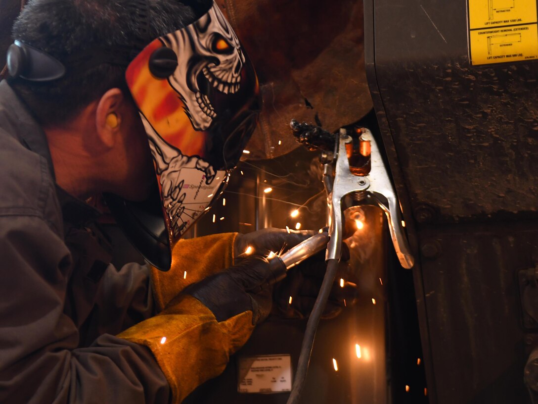 Yi Si-chun, 51st Logistics Readiness Squadron technician, welds the side of a vehicle at the Vehicle Maintenance Shop on Osan Air Base, Republic of Korea, March 22, 2017. Approximately 35 civilians and 70 Airmen work together in the Vehicle Maintenance Shop to ensure Team Osan’s vehicle fleet receives quality repairs as quickly as possible. (U.S. Air Force photo by Staff Sgt. Alex Fox Echols III/Released)