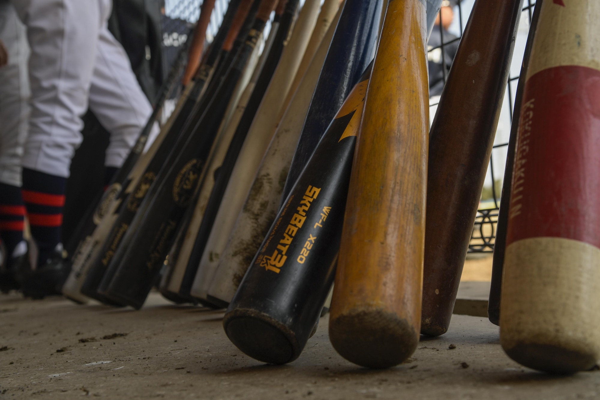 Bats sit in the Chofu Little Seniors dugout during the Inaugural Japan-US Friendship Youth Baseball Game at Yokota Air Base, Japan, March 25, 2017. The event marks the beginning of the spring baseball season on base and strengthened ties between the Yokota and Japanese youth through baseball. (U.S. Air Force photo by Staff Sgt. David Owsianka)