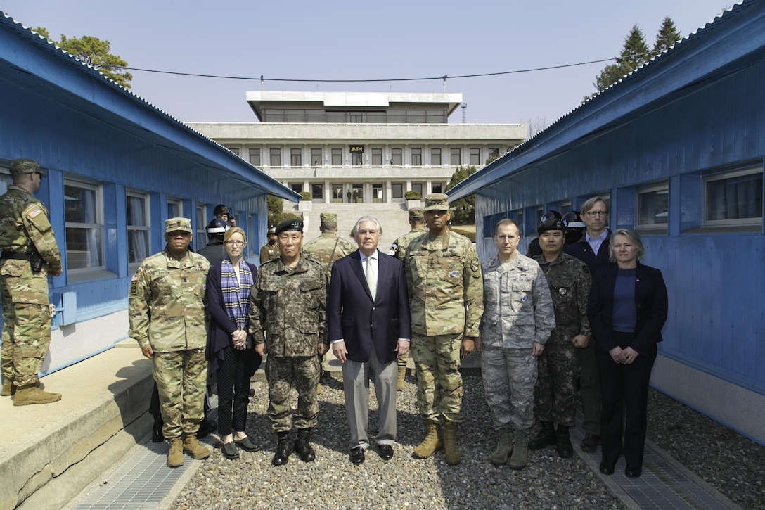 Gen. Vincent K. Brooks, United Nations Commander, Combined Forces Commander, and United States Forces Korea commander, and U.S. Secretary of State Rex Tillerson pose for a photograph with their respective staffs at the Korean border located inside the Joint Security Area(JSA), Mar. 17, 2017. Secretary Tillerson made a stop in Korea during his first visit to Asia as Secretary of State.