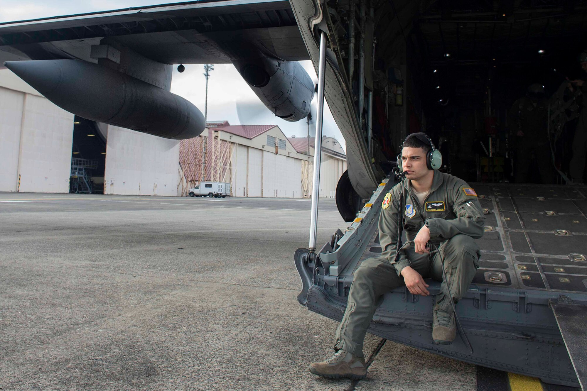 U.S. Air Force Senior Airman Angel Torres, 36th Airlift Squadron C-130 loadmaster, waits for U.S. Marines jumpers on board at Yokota Air Base, Japan, March 23, 2017, during jump week. The training not only allowed the Marines to practice jumping, but it also allowed the Yokota aircrews to practice flight tactics and timed-package drops. (U.S. Air Force photo by Yasuo Osakabe)