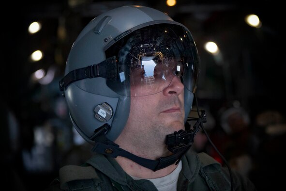 U.S. Air Force Staff Sgt. Dillon Howell, 36th Airlift Squadron C-130 loadmaster, observes a U.S. Marine jumpmaster perform his checks executing a High altitude – low opening jump over the drop zone in Yokota Air Base, Japan, March 23, 2017, during jump week. The training not only allowed the Marines to practice jumping, but it also allowed the Yokota aircrews to practice flight tactics and timed-package drops. (U.S. Air Force photo by Yasuo Osakabe)
