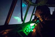 U.S. Air Force Capt. Jeremy Sarro, 36th Airlift Squadron C-130 pilot, checks flight instruments with the use of night-vision goggles during jump week above Yokota Air Base, Japan, March 23, 2017. The training not only allowed the Marines to practice jumping, but it also allowed the Yokota aircrews to practice flight tactics and timed-package drops day and night. (U.S. Air Force photo by Yasuo Osakabe)