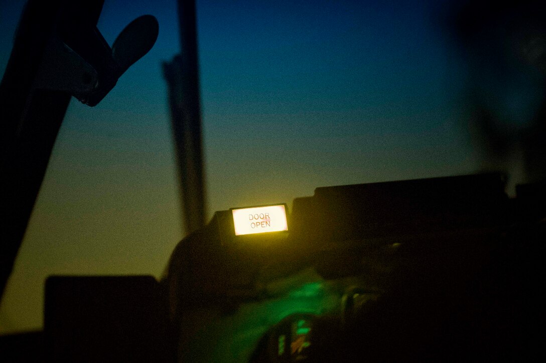 Door open light on a cockpit panel of a C-130 Hercules is indicated to pilots the back of the cargo door open during jump week over Yokota Air Base, Japan, March 23, 2017. (U.S. Air Force photo by Yasuo Osakabe)