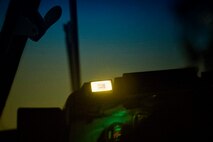 Door open light on a cockpit panel of a C-130 Hercules is indicated to pilots the back of the cargo door open during jump week over Yokota Air Base, Japan, March 23, 2017. (U.S. Air Force photo by Yasuo Osakabe)