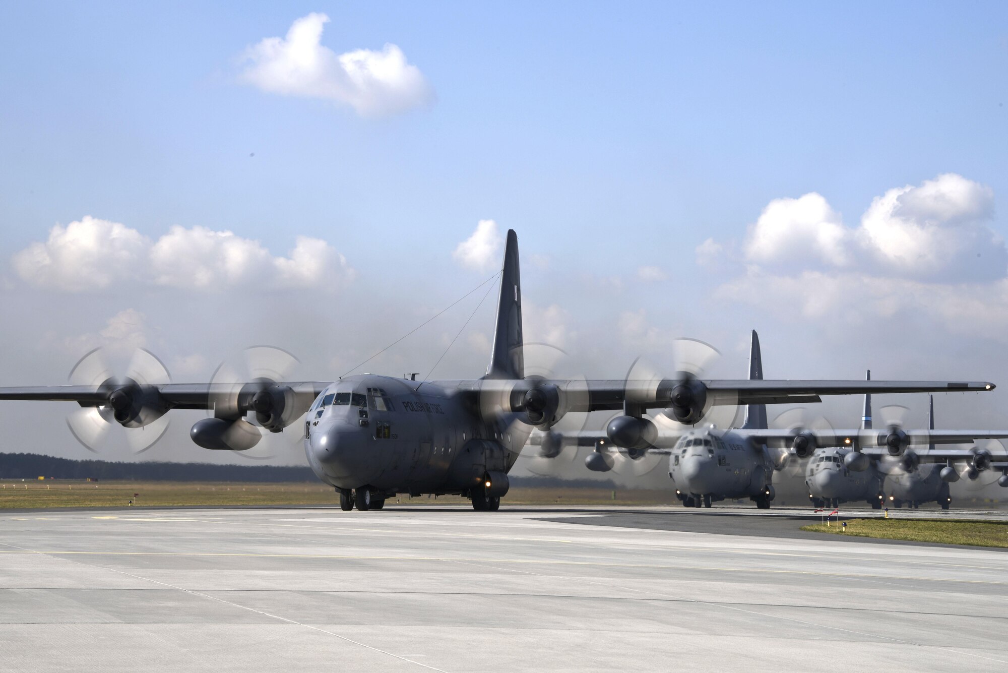 U.S. and Polish C-130 Hercules aircraft prepare to fly a 4-ship formation at Powidz Air Base, Poland, March 24, 2017.  Airmen from both countries participated in bilateral training during Aviation Detachment 17-2 in support of Operation Atlantic Resolve.  These bilateral trainings focused on maintaining joint readiness while building interoperability.  (Air National Guard photo by Staff Sgt. Alonzo Chapman/Released).