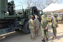 Soldiers of the 15th Engineer Battalion and the Army Reserve’s 361st Engineer Co., from Warner-Robbins, Georgia, speak to passersby along the Rhine River Saturday, March 24, 2017 in Nierstein, Germany. Americans and Germans gathered for the dedication ceremony for a monument to the 249th Engineer Combat Battalion’s efforts at the end of World War II, building a bridge across the river near Nierstein during an operation that helped shorten the war.