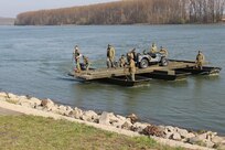 World War II re-enactors land a bridging boat on the bank of the Rhine River Saturday, March 24, 2017 in Nierstein, Germany. Americans and Germans gathered for the dedication ceremony for a monument to the 249th Engineer Combat Battalion’s efforts at the end of World War II, building a bridge across the river near Nierstein during an operation that helped shorten the war.