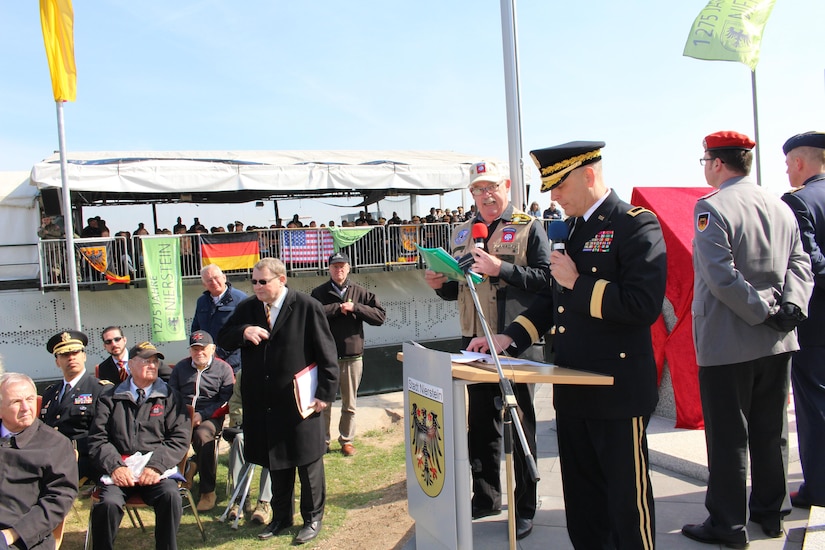 Army Reserve Brig. Gen. Philip Jolly, the deputy commanding general for Mobilization and Reserve Affairs, speaks during the monument dedication ceremony Saturday, March 24, 2017 in Nierstein, Germany. Americans and Germans gathered for the dedication ceremony for a monument to the 249th Engineer Combat Battalion’s efforts at the end of World War II, building a bridge across the river near Nierstein during an operation that helped shorten the war.