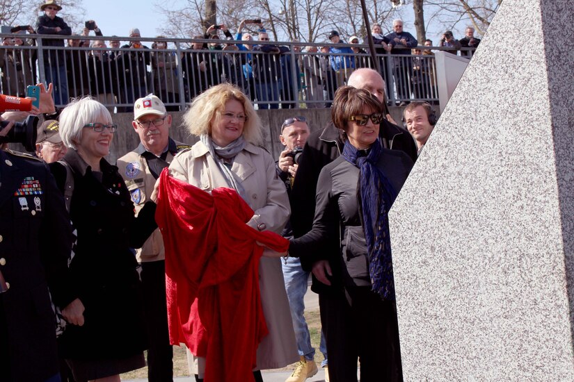 Helen Patton, left, the granddaughter of U.S. Army Gen. George Patton; Catherine Rommel, center, the granddaughter of German Field Marshall Erwin Rommel; Luci Schey, president of the Ralph and Luci Schey Foundation, examine a memorial to the Soldiers of the 249th Engineer Combat Battalion Saturday, March 24, 2017 in Nierstein Germany. 