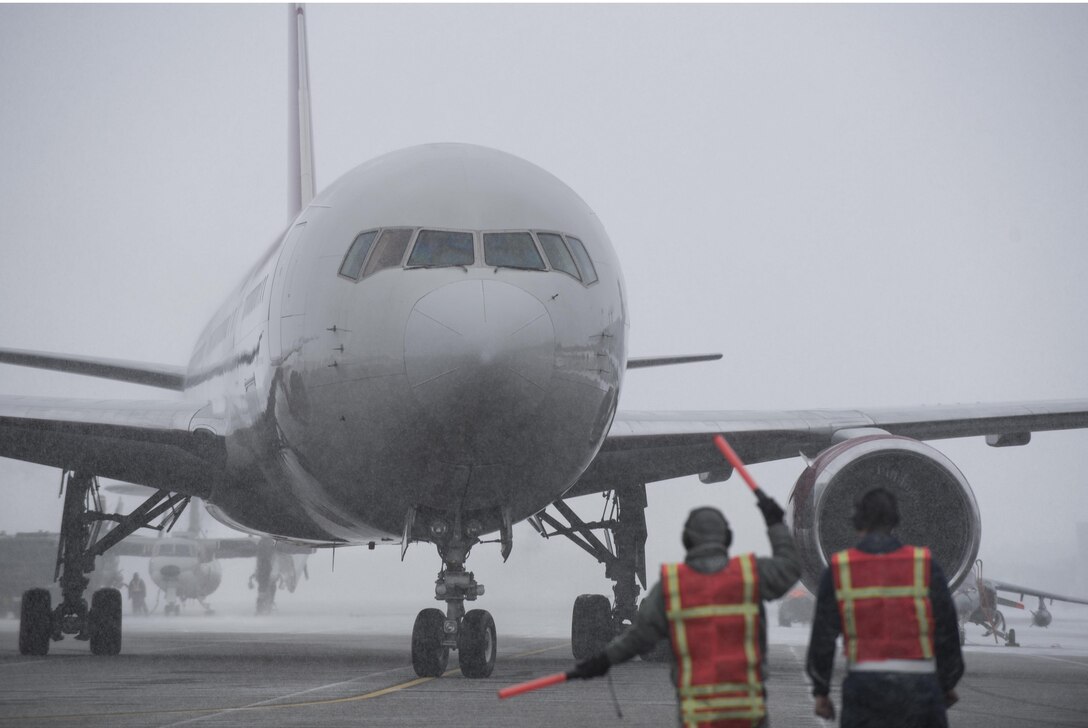 U.S. Air Force Airmen with the 35th Maintenance Squadron taxi an aircraft at Misawa Air Base, Japan, Jan. 23, 2017. With the flightline closure, personnel can use other commercial airports to fly throughout the Indo-Asia- Pacific region and to the United States. (U.S. Air Force photo by Airman 1st Class Sadie Colbert)