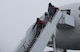 U.S. Air Force Airmen and families exit from the rotator at Misawa Air Base, Japan, Jan. 23, 2017. The terminal processes approximately 2,500 people for Space-Available. Space-A is the utilization of any vacant aircraft seating to charter military members to various AMC terminals for a low-cost fee. (U.S. Air Force photo by Airman 1st Class Sadie Colbert)