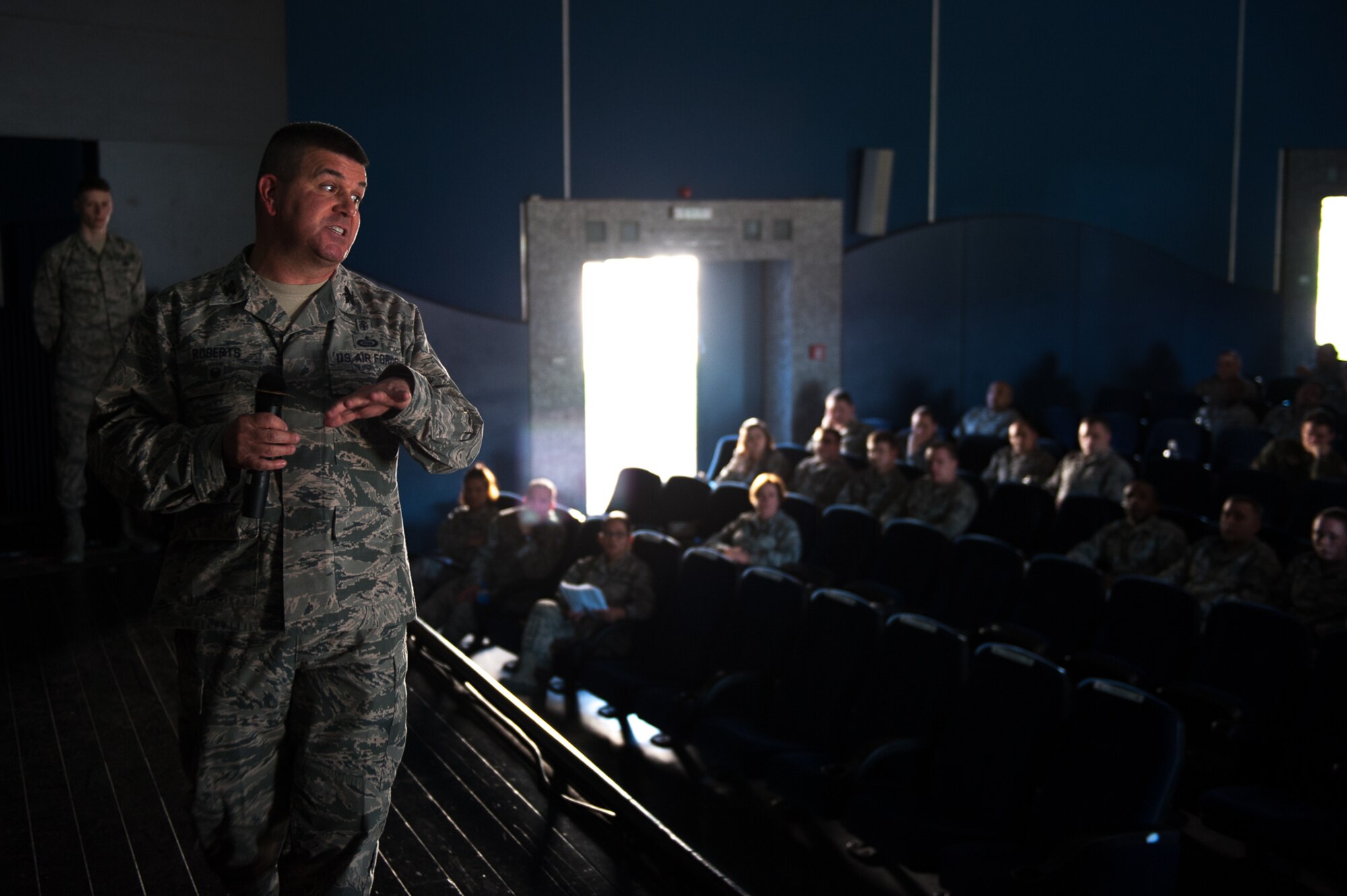 U.S. Air Force Col. Michael Roberts, 86th Medical Group Deputy Commander, speaks to Airmen during a kick-off event for the Air Force Assistance Fund at the Hercules Theater on Ramstein Air Base, March 27, 2017. Roberts told his story about how the AFAF assisted him when he was a young Airman. (U.S. Air Force photo by Senior Airman Devin Boyer/Released)