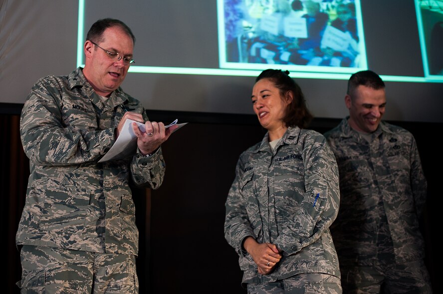 U.S. Air Force Brig. Gen. Richard G. Moore, 86th Airlift Wing Commander, provided the first donation for the Air Force Assistance Fund to Capt. Elba Tanikawa, installation project officer, and Master Sgt. Michael Knipmeyer, assistant installation project officer, at the Hercules Theater on Ramstein Air Base, March 27, 2017. The goal for this year’s campaign is $176,072. (U.S. Air Force photo by Senior Airman Devin Boyer/Released)