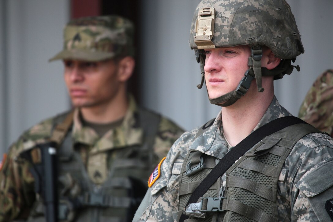 New Jersey National Guardsmen listen to a safety briefing before participating in the M9 Beretta pistol marksmanship portion of the Best Warrior competition at Joint Base McGuire-Dix-Lakehurst, N.J., March 27, 2017. Soldiers and noncommissioned officers are competing in timed events, including urban-warfare simulations, a 12-mile rucksack march, land navigation, and the Army physical fitness test. Air National Guard photo by Master Sgt. Matt Hecht