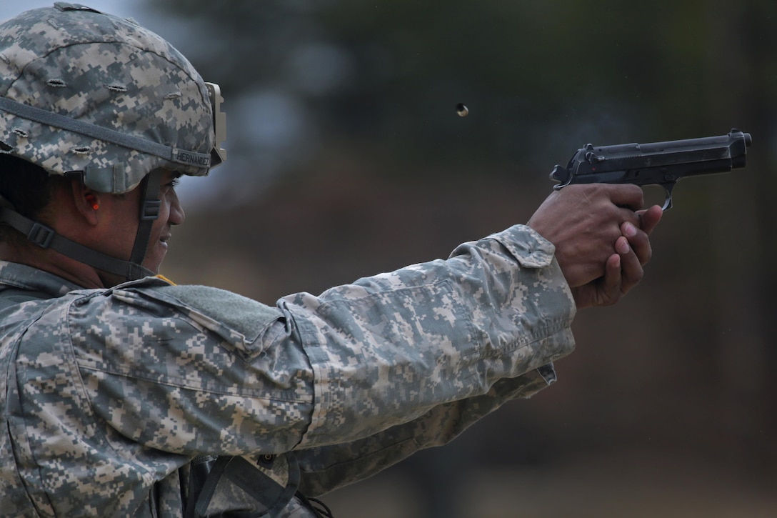 A Guardsman fires his M9 Beretta during the pistol marksmanship portion of the Best Warrior competition at Joint Base McGuire-Dix-Lakehurst, N.J., March 27, 2017. Air National Guard photo by Master Sgt. Matt Hecht