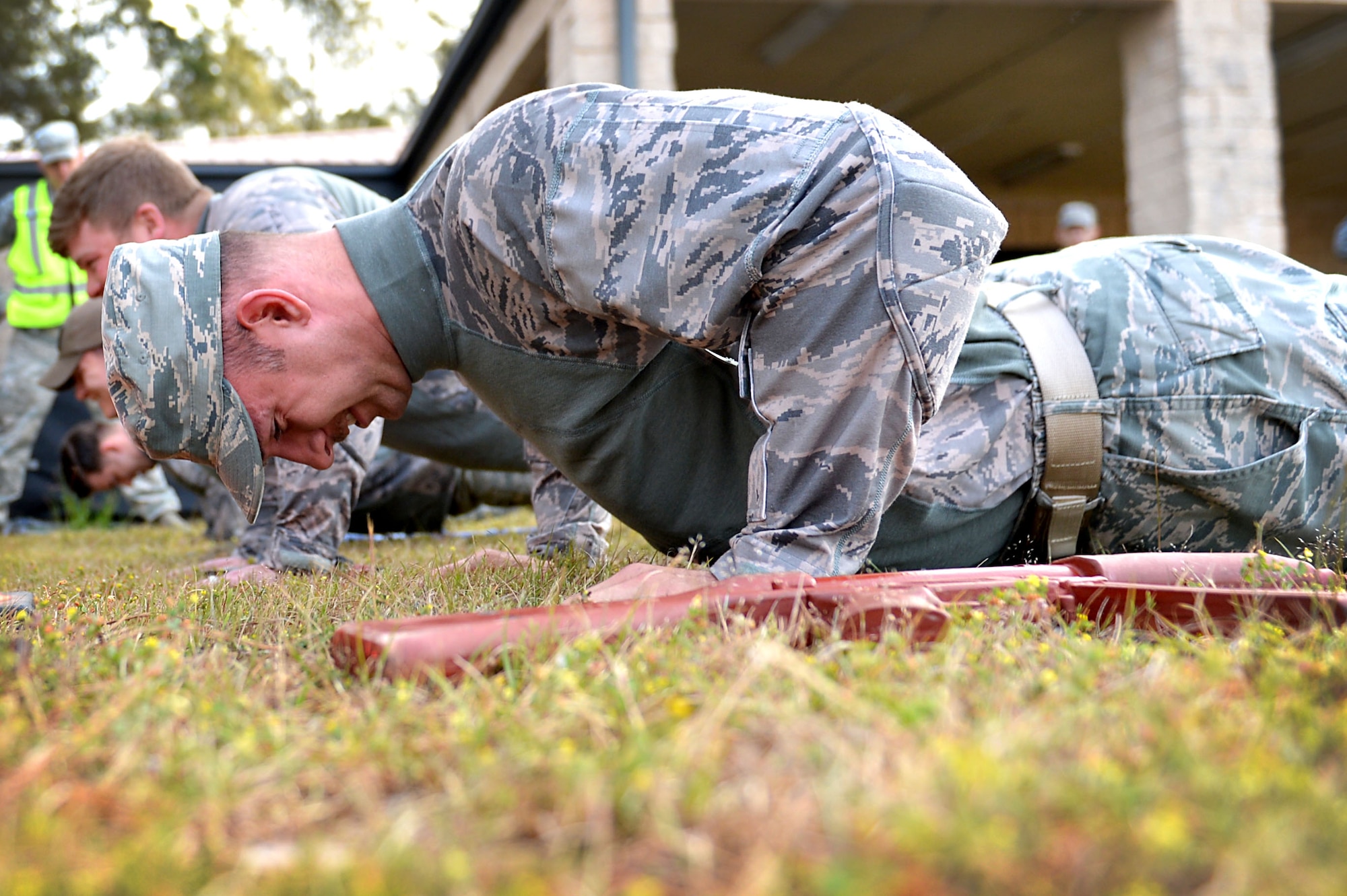 U.S. Air Force Staff Sgt. Jason Perkins, 20th Security Forces Squadron (SFS) unit trainer, performs a push-up wearing a weighted uniform during the 20th SFS Combat Challenge at Shaw Air Force Base, S.C., March 24, 2017. The obstacle courses consisted of a 45-pound ruck march, chemical warfare memory games and many other challenges, each focusing on different aspects of a 20th SFS Airman, or defender’s, career. (U.S. Air Force photo by Airman 1st Class Christopher Maldonado)