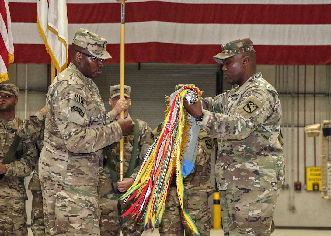 BAGRAM AIRFIELD, Afghanistan (Mar. 26, 2017) - U.S. Army Col. James E. Walker and Command Sgt. Maj. Edward A. Baptiste unfurl the 525th Expeditionary Military Intelligence Brigade unit colors during the transfer of authority ceremony held here today.  TF ODIN transferred the Afghanistan-theater Intelligence, Surveillance, and Reconnaissance mission to TF Lightning (525th E-MIB). Walker and Baptiste are the 525th E-MIB commander and command sergeant major.

Photo by Jet Fabara, U.S. Forces Afghanistan Public Affairs.