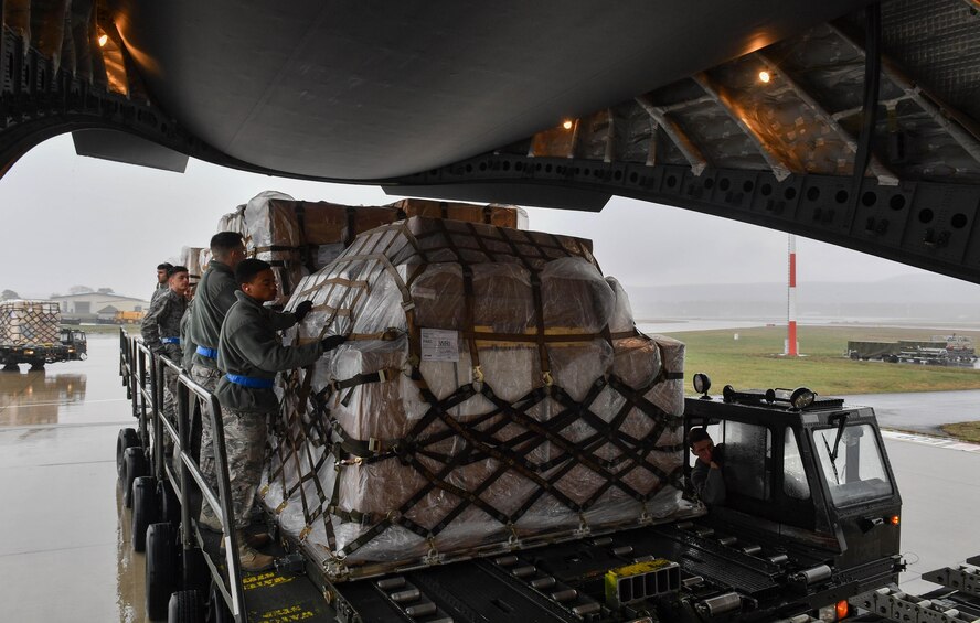 Students of the 721st Aerial Port Squadron’s Unit Learning Center prepare pallets of cargo to be loaded onto a C-17 Globemaster III during hands-on training for the class on Ramstein Air Base, Germany, March 21, 2017. The center provides upgrade training for new Airmen from Ramstein; Spangdahlem Air Base, Germany; Royal Air Force Mildenhall, England; and Aviano Air Base, Italy. (U.S. Air Force photo by Senior Airman Tryphena Mayhugh)