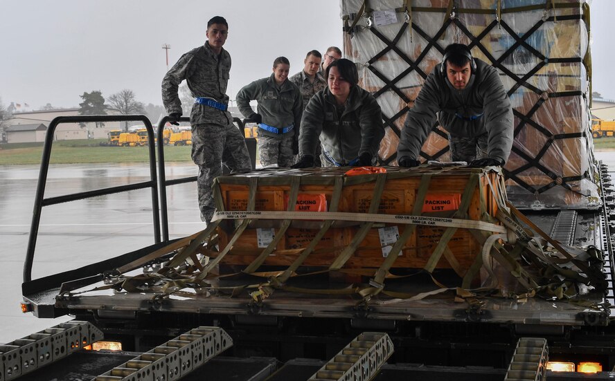 Airman 1st Class Jessica Thornhill (left) and Airman Garrett Johnson, both 727th Air Mobility Squadron air transportation technicians, push a pallet of cargo onto a C-17 Globemaster III on Ramstein Air Base, Germany, March 21, 2017. Thornhill and Johnson were students of the 721st Aerial Port Squadron’s Unit Learning Center, which provides classroom and hands-on upgrade training for 521st Air Mobility Operations WIng Airmen in passenger services, air freight, and ramp services. (U.S. Air Force photo by Senior Airman Tryphena Mayhugh)