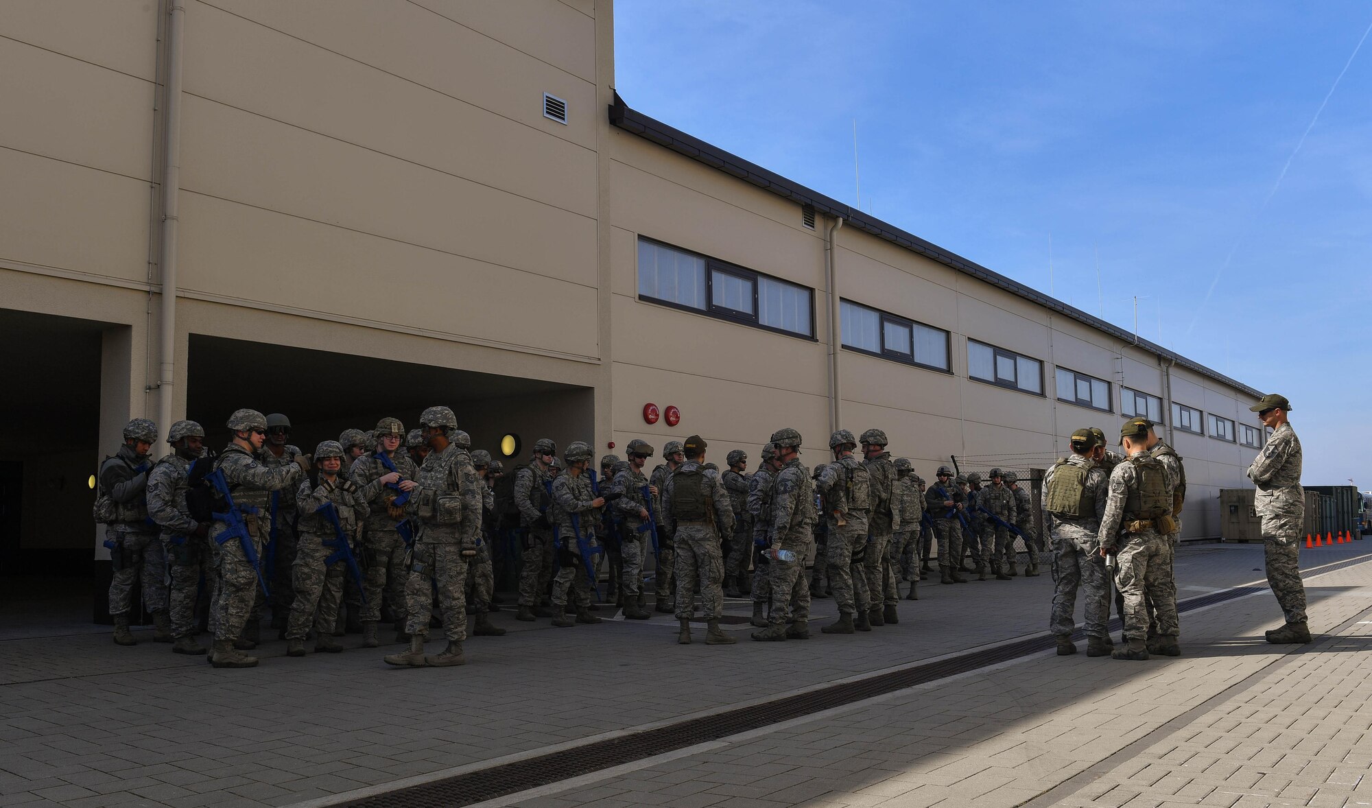 Students and instructors of the 435th Security Forces Squadron’s Ground Combat Readiness Training Center’s Security Operations Course gather outside before conducting a variety of hands-on training on Ramstein Air Base, Germany, March 25, 2017. The two-week course began March 24 and provides pre-deployment training to security forces Airmen who will be going downrange. Airmen assigned to the 86th SFS, 422nd SFS, 100th SFS, and 569th U.S. Forces Police Squadron participated in the course. (U.S. Air Force photo by Senior Airman Tryphena Mayhugh)