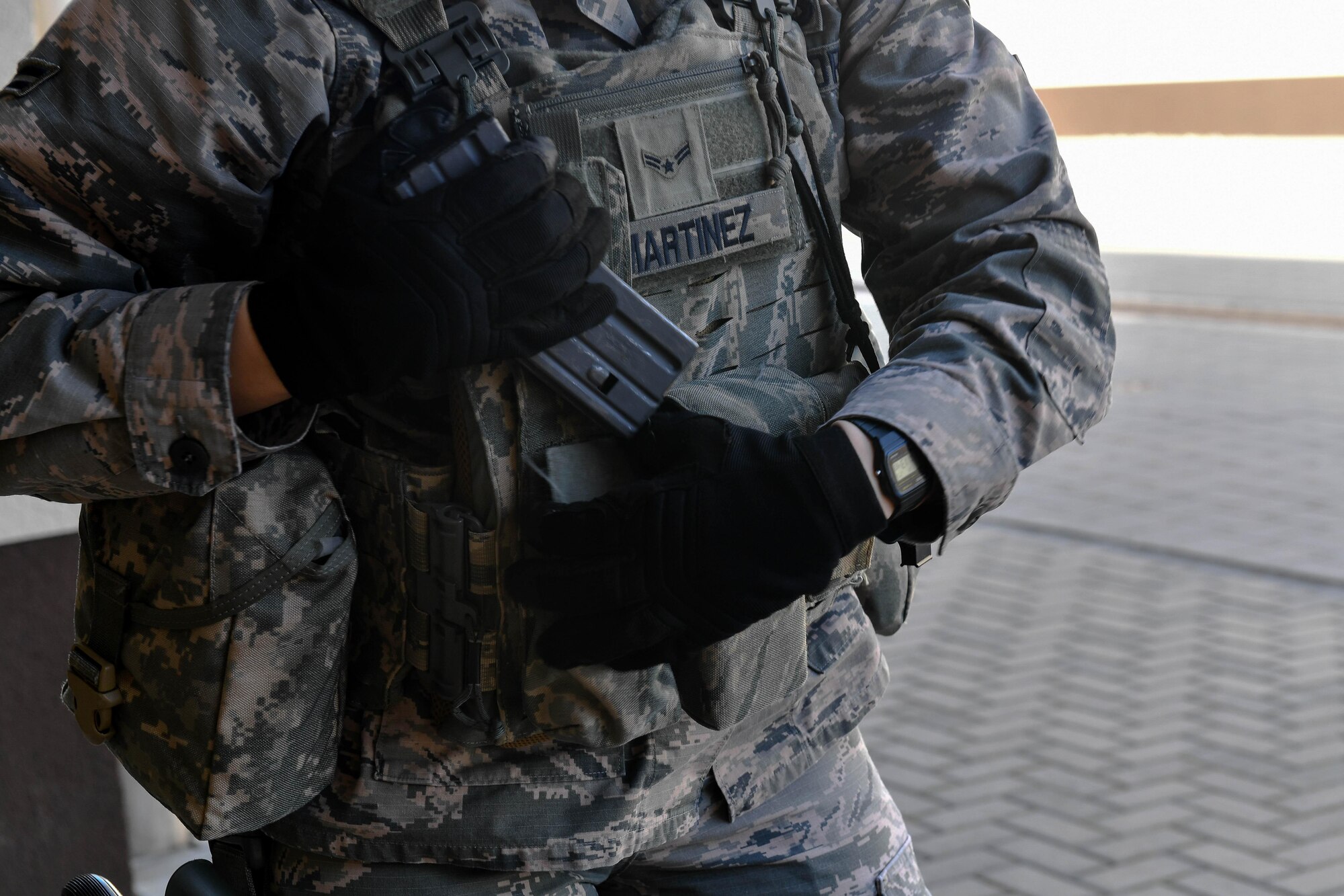 Airman 1st Class Diana Martinez Montano, 422nd Security Forces Squadron patrolman, loads magazines into her vest during the weapons manipulation portion of the 435th SFS’s Ground Combat Readiness Training Center’s Security Operations Course on Ramstein Air Base, Germany, March 25, 2017. The purpose of the two-week course is to prepare security forces Airmen who are deploying downrange. Airmen assigned to the 86th SFS, 422nd SFS, 100th SFS, and 569th U.S. Forces Police Squadron participated in the course. (U.S. Air Force photo by Senior Airman Tryphena Mayhugh)