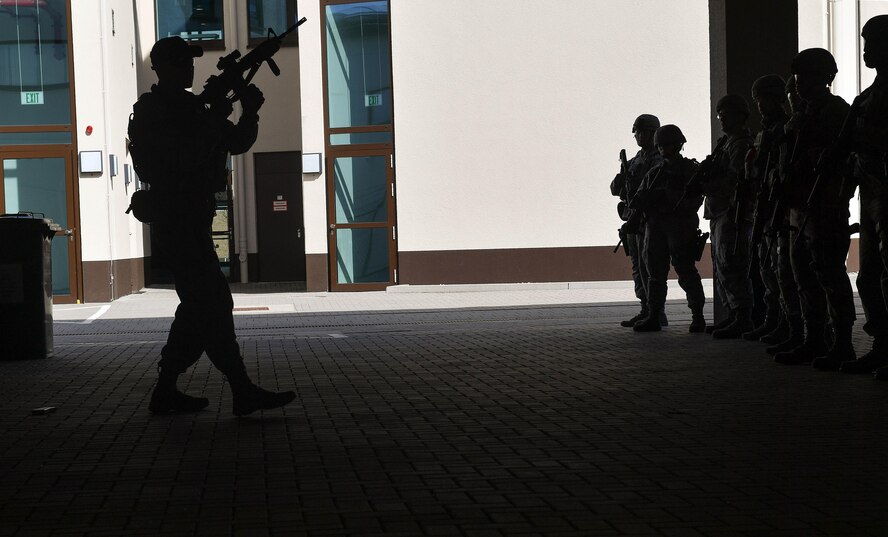 Staff Sgt. Franklin Sloat, 435th Security Forces Squadron Ground Combat Readiness Training Center instructor, demonstrates reloading a magazine for an M-16 rifle during the weapons manipulation portion of the Security Operations Course on Ramstein Air Base, Germany, March 25, 2017. The weapons manipulation training included gear placement, fighter stance, shooter’s platform, loading, reloading, and transitions. Airmen assigned to the 86th SFS, 422nd SFS, 100th SFS, and 569th U.S. Forces Police Squadron participated in the course. (U.S. Air Force photo by Senior Airman Tryphena Mayhugh)