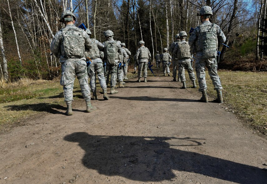 Students of the 435th Security Forces Squadron’s Ground Combat Readiness Training Center’s Security Operations Course form up before beginning the improvised explosive device detection portion of the course on Ramstein Air Base, Germany, March 25, 2017. During the IED detection portion, the students marched through a wooded area and had to detect devices hidden along the way. Airmen assigned to the 86th SFS, 422nd SFS, 100th SFS, and 569th U.S. Forces Police Squadron participated in the course. (U.S. Air Force photo by Senior Airman Tryphena Mayhugh)