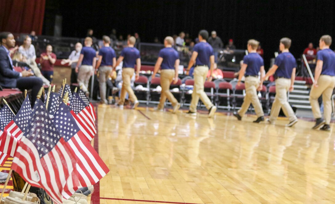 Marine Corps poolees walk off the court to a standing ovation after reciting the Oath-of-Enlistment before a Canton Charge basketball game March 3, 2017 in Canton, Ohio.  The Canton Charge invited the poolees to the game to do an on-court swear-in during their military appreciation game. The poolees are from various Marine Corps Recruiting Substations from Marine Corps Recruiting Station Cleveland and are schedule to attend recruit training. (U.S. Marine Corps photo by Sgt. Stephen D. Himes/Released)
 
