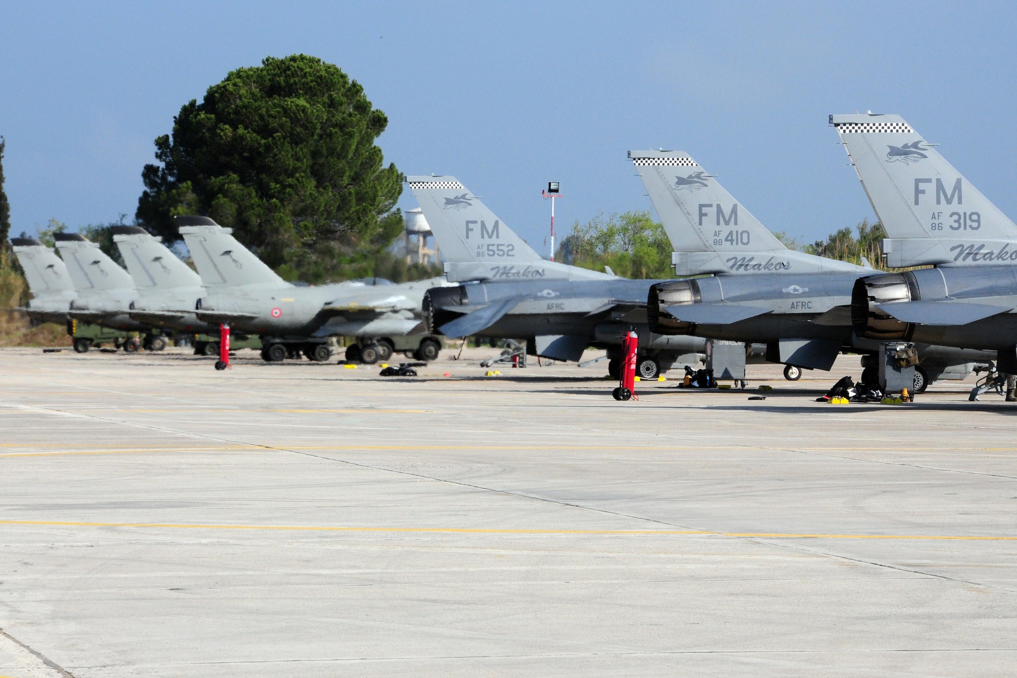 Italian and U.S. Air Force F-16Cs are parked on the flightline at Andravida Air Base Greece, Mar. 27, 2017 during INIOHOS 17.  The U.S. and Greece, as NATO allies, are participating in this exercise to promote peace and stability, and to seek opportunities to continue developing  a relationship. (U.S. Air Force photo by Staff Sgt. Ciara Gosier)