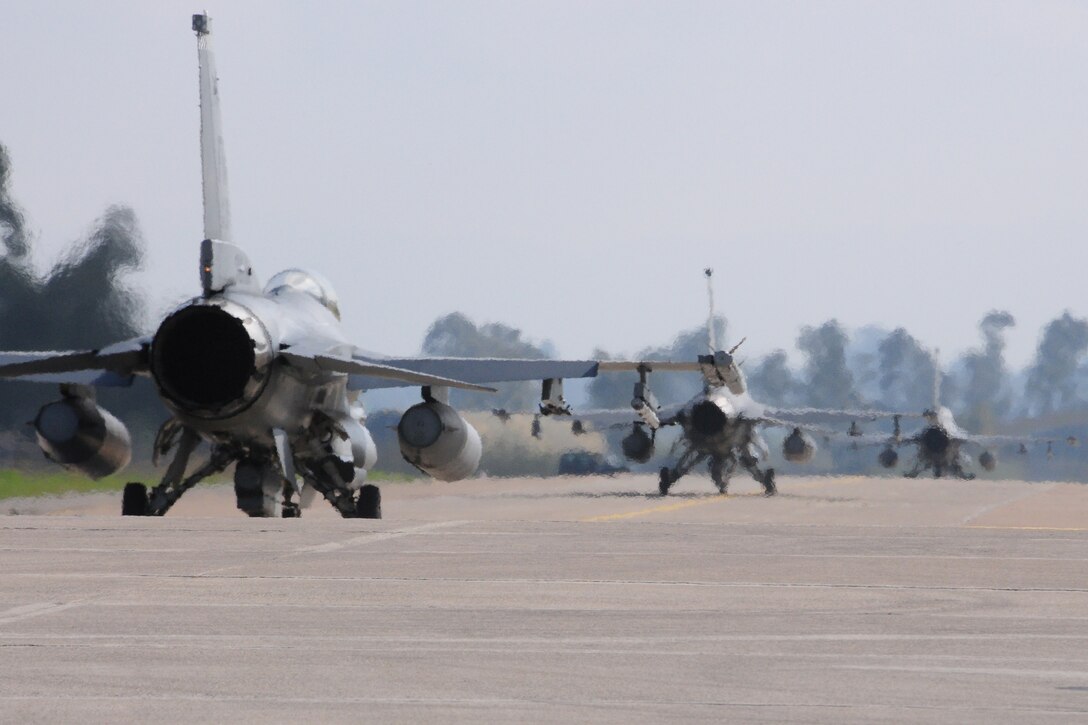 Three F-16C Fighting Falcons from Homestead Air Reserve Base, Fla., taxi for a sortie during INIOHOS 17 at Andravida Air Base, Greece, Mar. 27, 2017. INIOHOS 17 is a Hellenic Air Force-led, large force, flying exercise between NATO Allies and partner nations. (U.S. Air Force photo by Staff Sgt. Ciara Gosier)