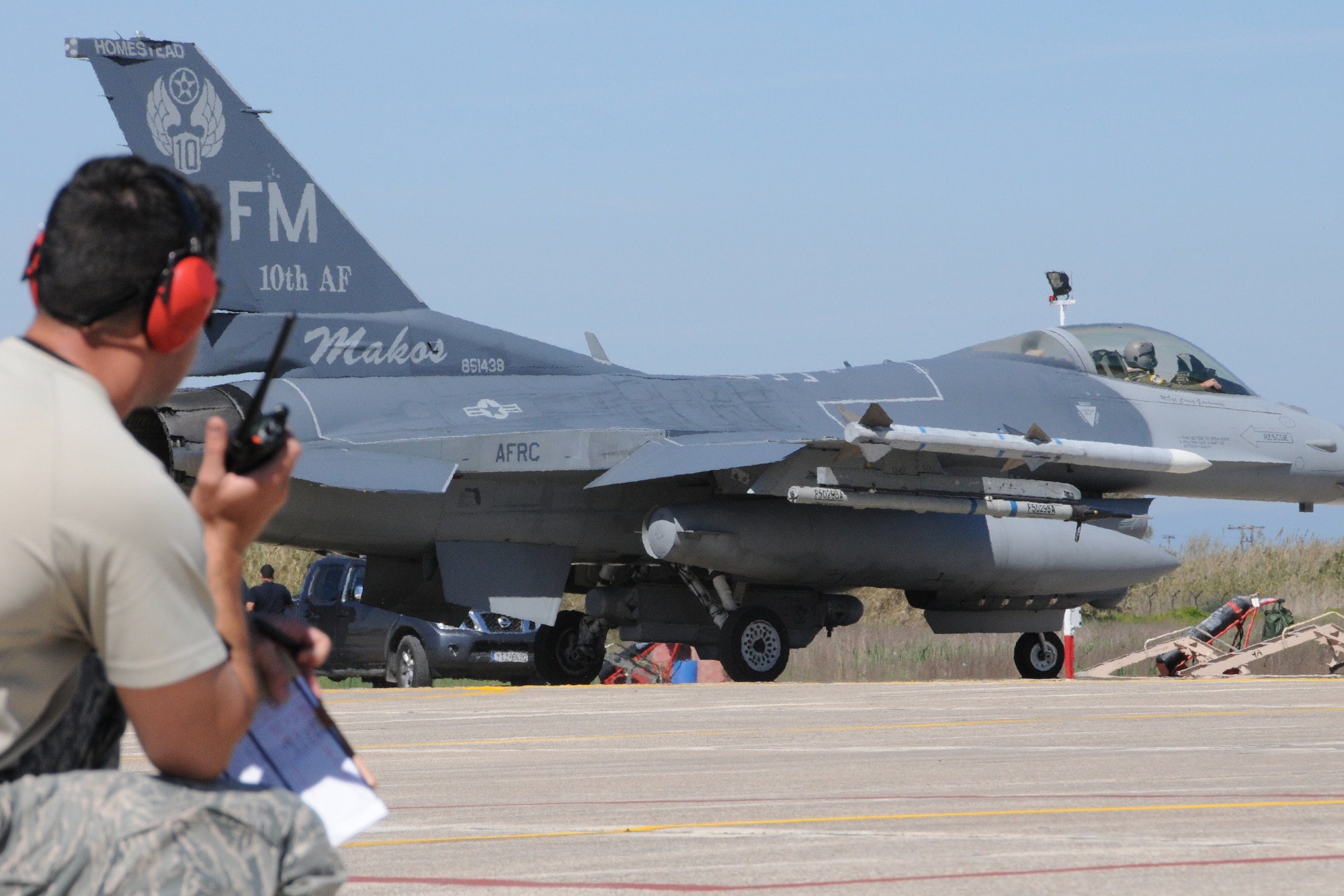 Airmen assigned to the 482nd Fighter Wing, Homestead Air Reserve Base, Fla., watch as an F-16C Fighting Falcon at Andravida Air Base, Greece, Mar. 24, 2017. The Airmen are participating in exercise INIOHOS 17, a multinational Hellenic Air Force-led large force flying exercise between NATO allies and partner nations. (U.S. Air Force photo by Staff Sgt. Ciara Gosier)