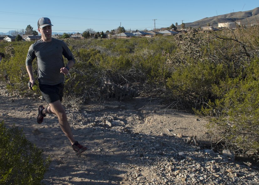 Staff Sgt. Phillip LaPoint, a 49th Maintenance Squadron stockpile technician, runs on a local trail on Feb. 15, 2017 in Alamogordo, N.M. On Jan. 7, 2017, LaPoint completed and won his first 50-mile ultra-marathon outside of Alexandria, Louisiana. (U.S. Air Force photo by Senior Airman Emily Kenney)