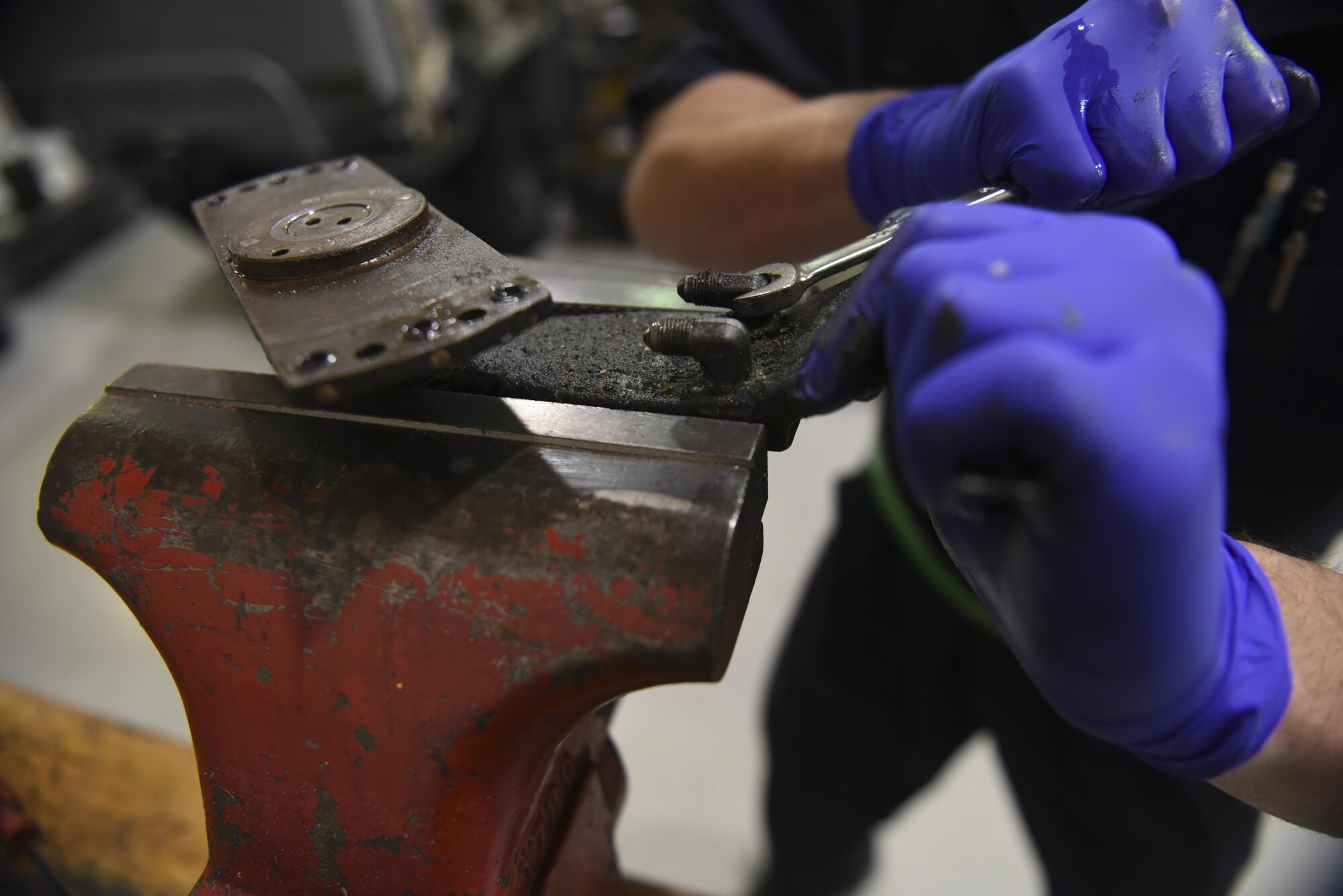 Senior Airman Daniel Angulo-Negron, 4th Equipment Maintenance Squadron aerospace ground equipment technician, loosens the bolts on a generator bracket, March 15, 2017, at Seymour Johnson Air Force Base, North Carolina. The AGE shop provides the equipment used by crew chiefs and other aircraft maintainers on the flight line. (U.S. Air Force photo by Airman 1st Class Victoria Boyton)