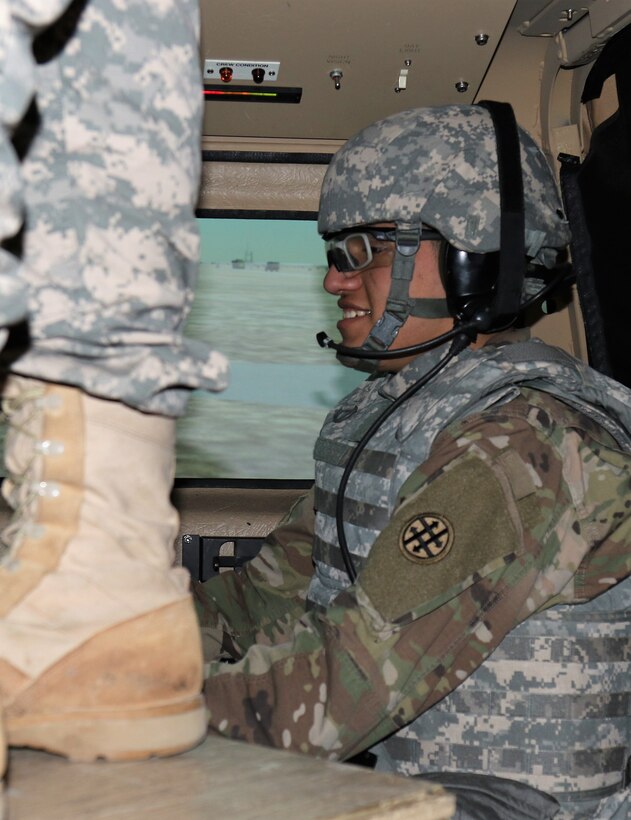 U.S. Army Reserve Pvt. 2nd Class Thomas Gonzales a Chemical, Biological, Radiological and Nuclear Specialist with the 373rd Combat Sustainment Support Battalion based in Beaumont, Texas, scans for enemies from the back seat of a HMMWV in the Reconfigurable Vehicle Tactical Trainer during Operation Cold Steel, at Fort McCoy, Wis., Mar. 21, 2017.  Operation Cold Steel is the U.S Army Reserve’s crew-served weapons qualification and validation exercise to ensure that America’s Army Reserve units and Soldiers are trained and ready to deploy on short-notice bringing combat-ready and lethal firepower in support of the Total Army and our Joint Force anywhere in the world. (U.S. Army Reserve photo by Maj. Brandon R. Mace)