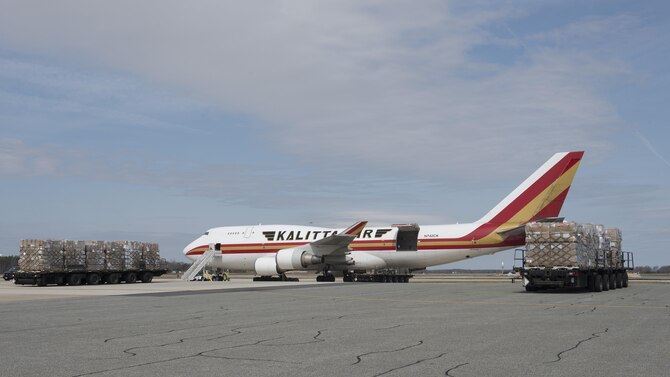 K-Loaders carrying cargo pallets preposition prior to an upload of a Kalitta Air Boeing 747 cargo plane March 24, 2017, at Dover Air Force Base, Del. Kalitta Air is a member of the Civil Reserve Air Fleet, a mobility resource contractually committed to support Department of Defense airlift requirements in emergencies and when the need for airlift exceeds military aircraft capability. (U.S. Air Force photo by Senior Airman Zachary Cacicia)