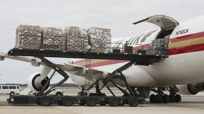 Cargo pallets are loaded onto a Kalitta Air Boeing 747 by 436th Aerial Port Squadron Airmen March 24, 2017, at Dover Air Force Base, Del. In addition to military airlifters, Dover AFB regularly sees civilian cargo planes that support Department of Defense missions. (U.S. Air Force photo by Senior Airman Zachary Cacicia)