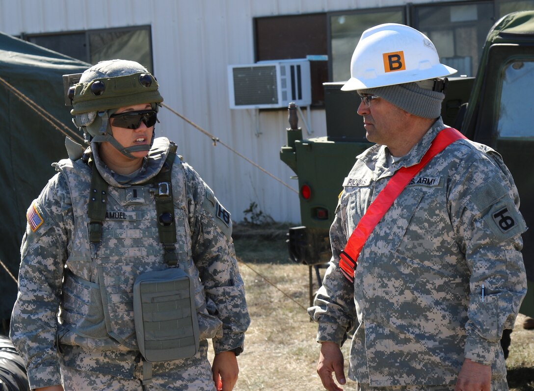 U.S. Army Reserve Capt. Kristina Samuel, commander of the 453rd Transportation Company based in Houston, Texas, and Staff Sgt. Rudy Rojas, Noncommissioned Officer in charge of the Central Receiving and Shipping Point with the 453rd TC, discuss current operations during a Warrior Exercise at Joint Base Mcguire-Dix-Lakehurst, N.J, Mar. 23, 2017.  Operations like this WAREX provide real-world training opportunities for today’s U.S. Army Reserve ensuring they remain the most lethal, capable and combat-ready federal reserve force in the history of our nation. (U.S. Army Reserve photo by Maj. Brandon R. Mace)