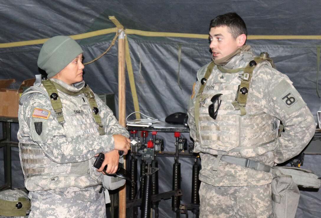 U.S. Army Reserve Capt. Kristina Samuel, commander of the 453rd Transportation Company based in Houston, Texas, and U.S. Army Reserve Sgt. Kenneth Perry, a Wheeled Vehicle Mechanic Recovery Specialist with the 453rd TC, discuss maintenance operations during a Warrior Exercise at Joint Base Mcguire-Dix-Lakehurst, N.J, Mar. 23, 2017.  Operations like this WAREX provide real-world training opportunities for today’s U.S. Army Reserve ensuring they remain the most lethal, capable and combat-ready federal reserve force in the history of our nation. (U.S. Army Reserve photo by Maj. Brandon R. Mace)