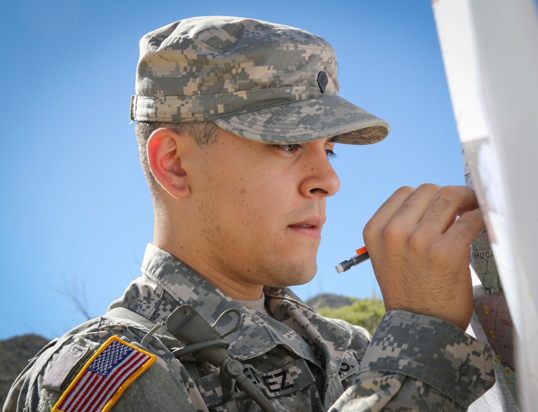 Army Reserve Spc. Josue Mendez, an information technology specialist and native of Stockton, California, assigned to the 319th Expeditionary Signal Battalion, 335th Signal Command (Theater), plots points on a map at the land navigation course at Fort Huachuca, Arizona March 27, as he and nine other Soldiers compete in the command's 2017 Best Warrior Competition. (U.S. Army Reserve photo by Sgt. 1st Class Brent C. Powell)