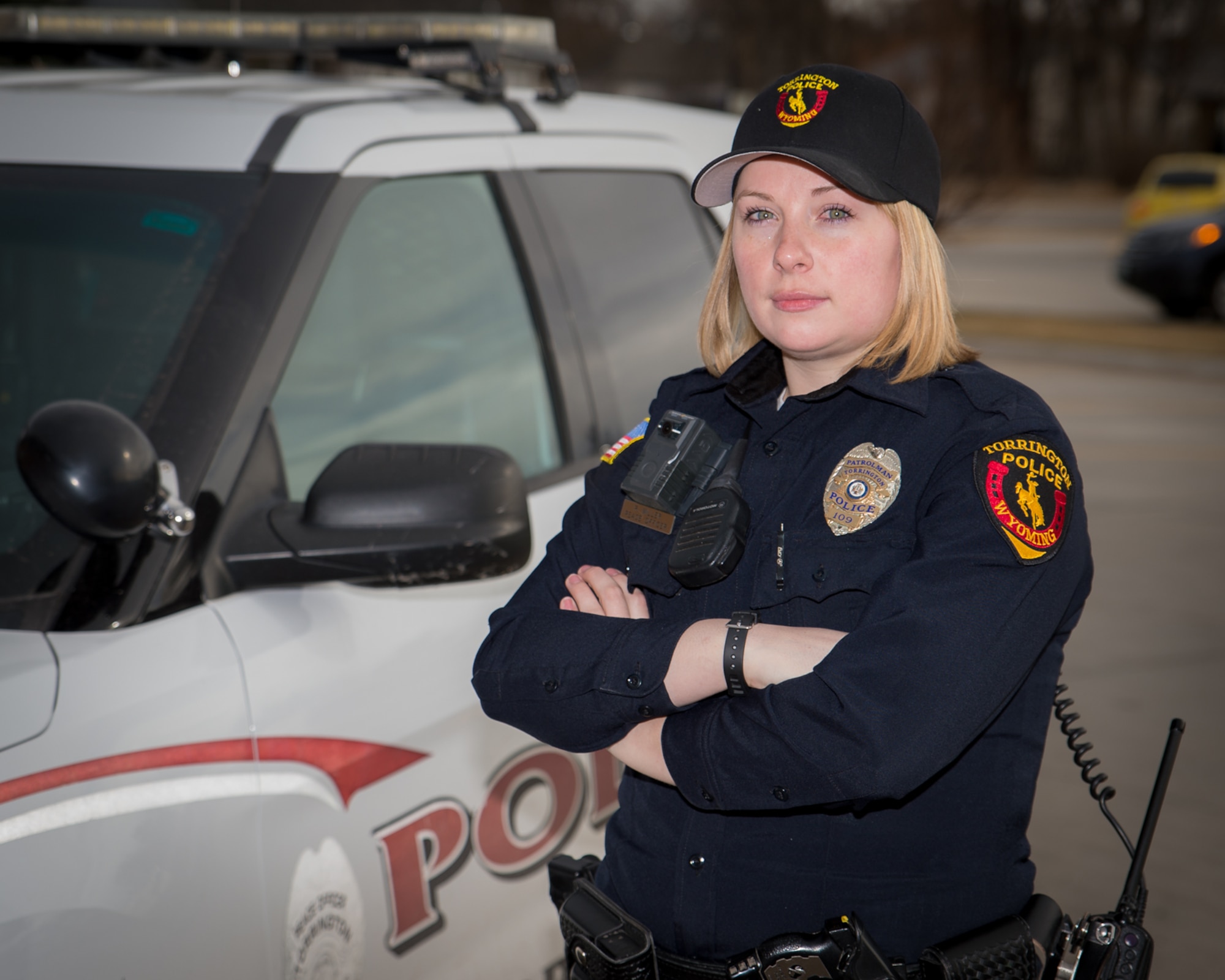 U.S. Air Force Staff Sgt. Rebekah Miller stands next to a Torrington police vehicle while wearing her police uniform, Mar. 10, 2017 in Torrington, Wyoming. Miller has been with the Wyoming Air National Guard for six years and is serving as a command post specialist. She has also been an officer with the Torrington police department for two years. (U.S. Air National Guard photo by Senior Master Sgt. Charles Delano/released)