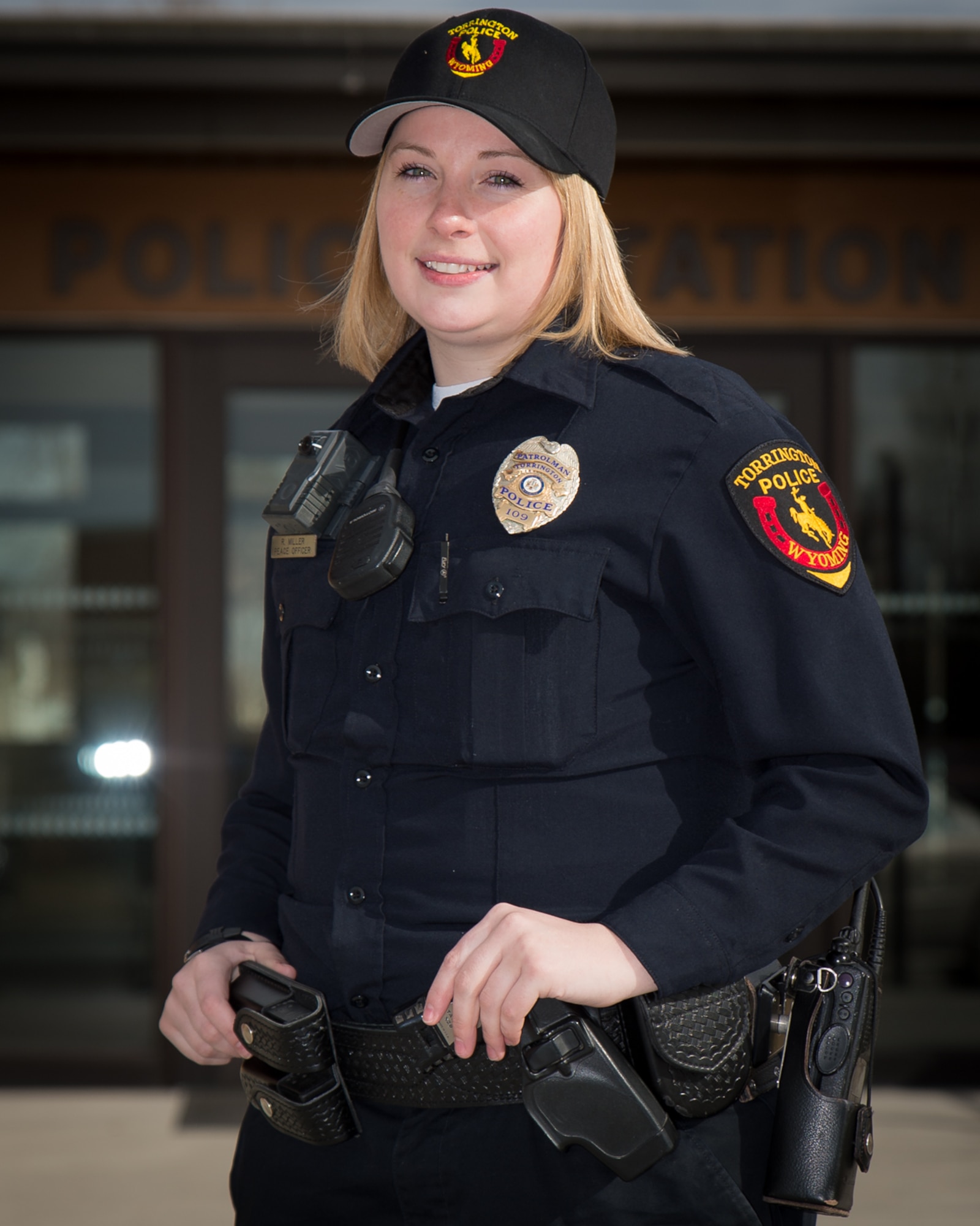 U.S. Air Force Staff Sgt. Rebekah Miller stands in front of the Torrington police department in her police uniform, Mar. 10, 2017 in Torrington, Wyoming. Miller has been with the Wyoming Air National Guard for six years and is serving as a command post specialist. She has also been an officer with the Torrington police department for two years. (U.S. Air National Guard photo by Senior Master Sgt. Charles Delano/released)