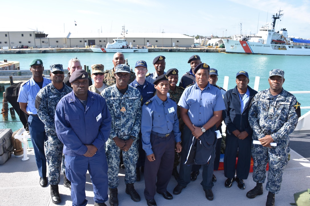 Partners from the Caribbean Basin Security Initiative's (CBSI) Technical Assist Field Team (TAFT) gather for photo aboard U.S. Coast Guard Cutter William Trump following an exchange in Key West, Fla.